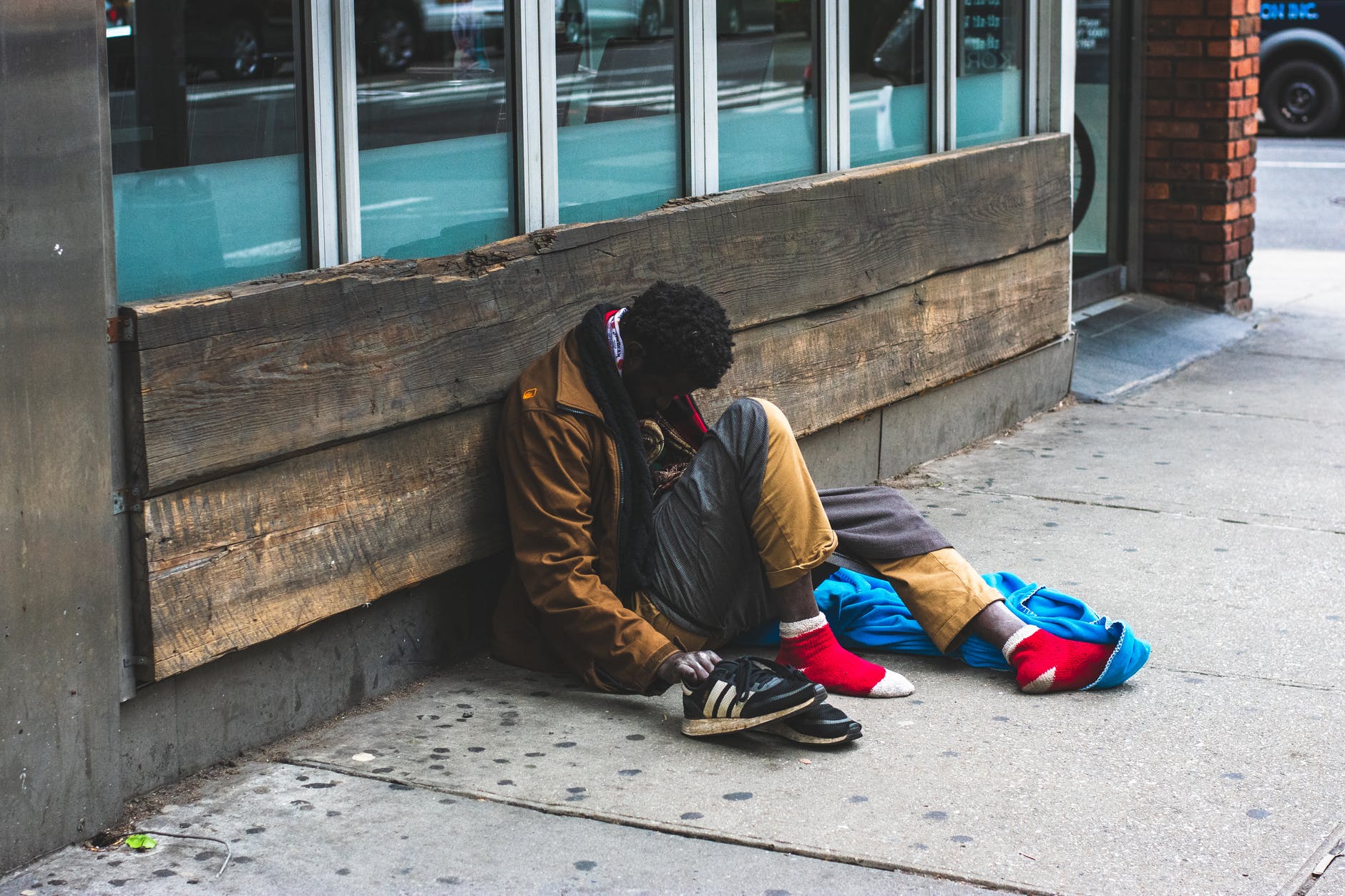 man sitting on street